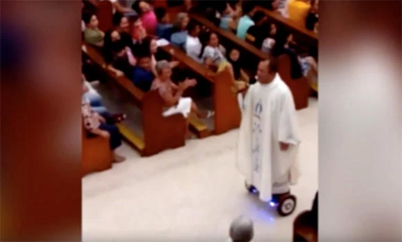 Sidelined Philippine priest ‘sorry’ after hoverboard stunt
