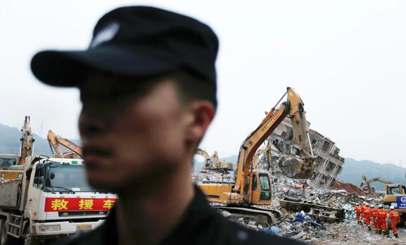 Authorities in China arrest 11 over deadly landslide