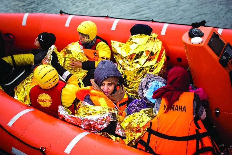 Aid groups create huge peace sign of life jackets on Greek isle