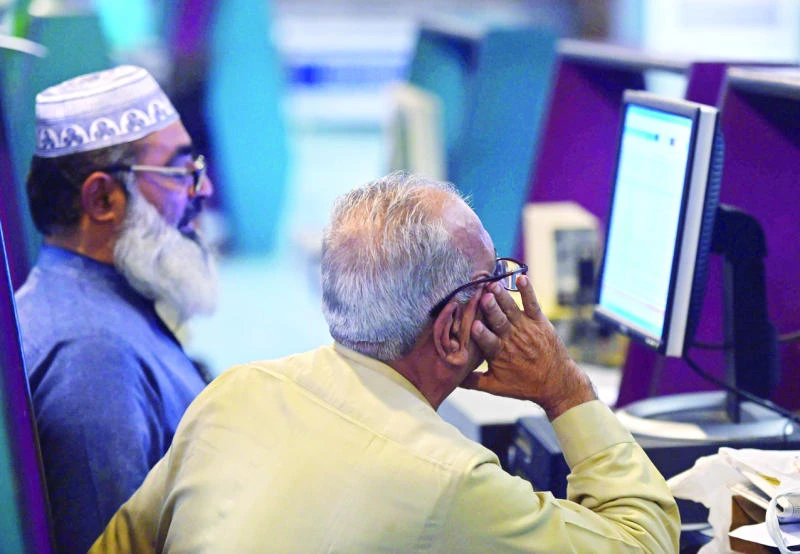 Karachi shares end lower; rupee weakens