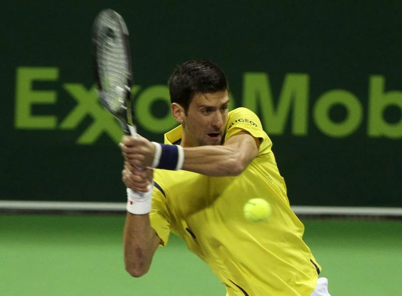 Djokovic makes short work of Brown to kick off season in Doha