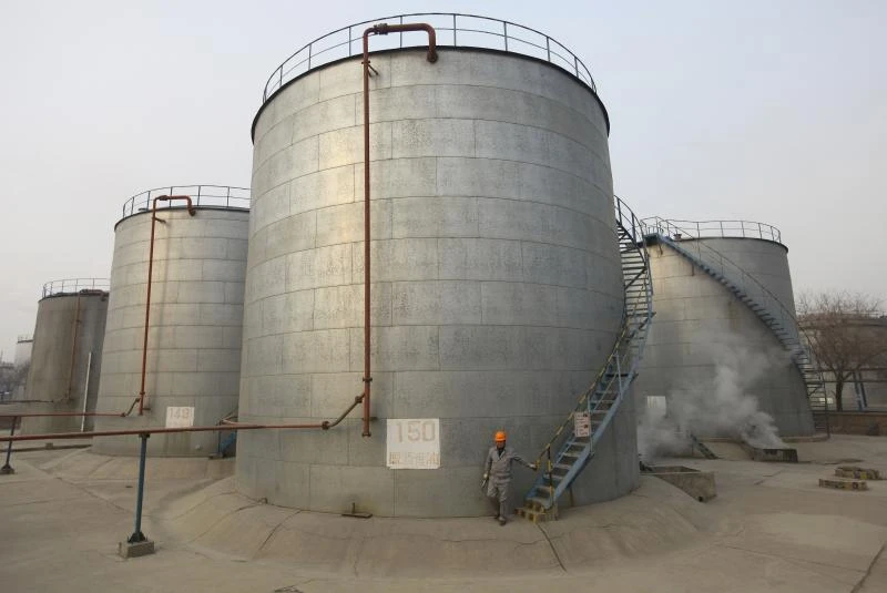 Oil pares losses after dive toward 12-year low
