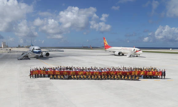 China lands civilian jets on disputed island, drawing protests