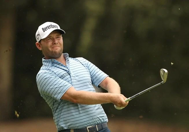 Grace surges into joint lead at rain-hit SA Open