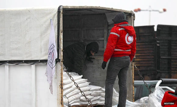 Aid trucks enter besieged Syria town