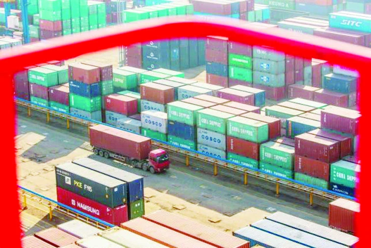 China's exports, imports fall after yuan slides
