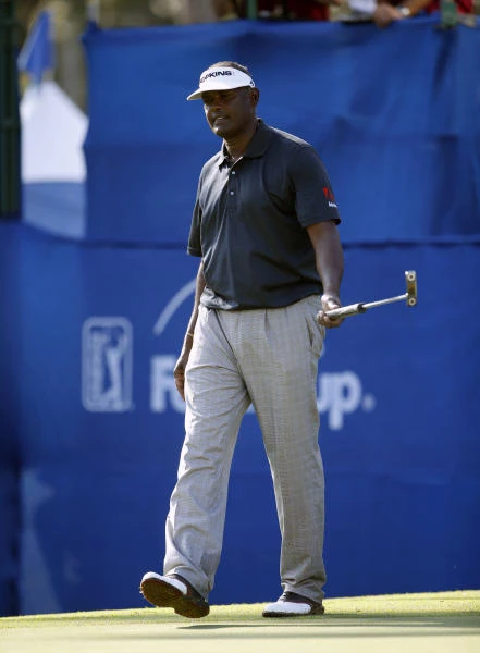 Vintage Singh on song to share lead on 63