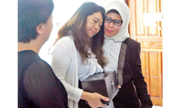Kin of Malaysian hostage retrieve remains