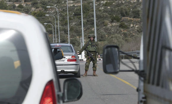 Israeli military partially closes main Palestinian city