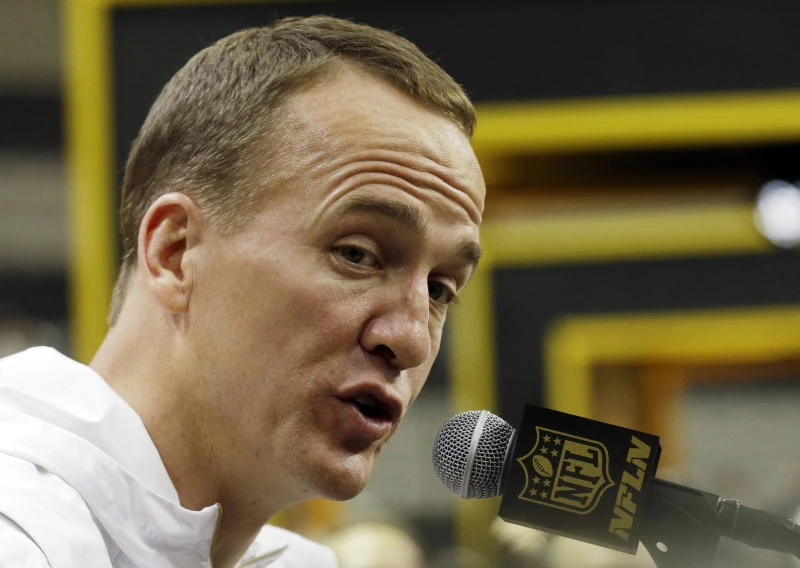 Manning plays down retirement talk
