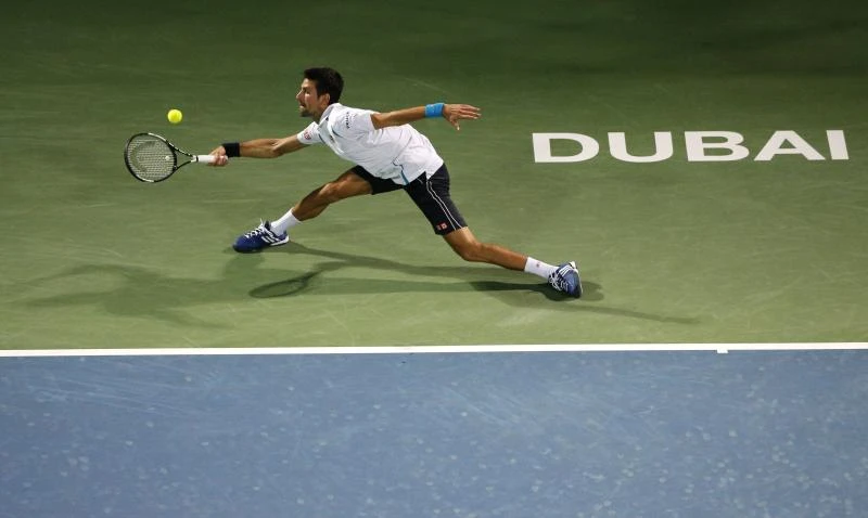 Djokovic eases into 700-win club in Dubai