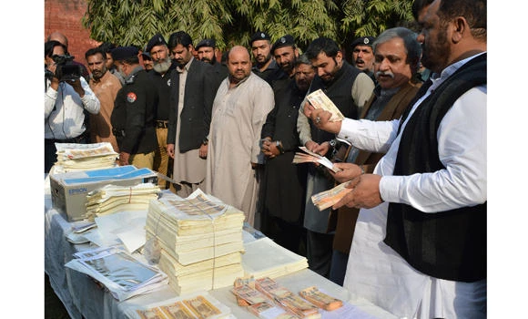 Pakistan police seize millions from fake currency factory