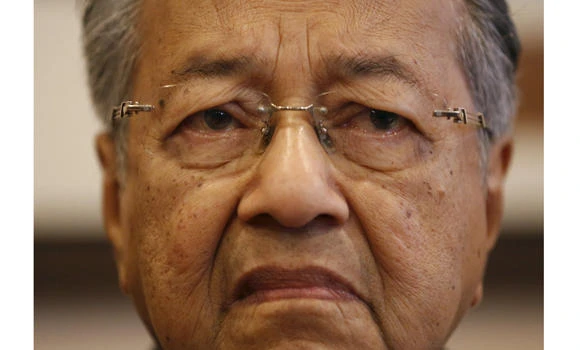 Mahathir quits Malaysia’s ruling UMNO party, protesting corruption