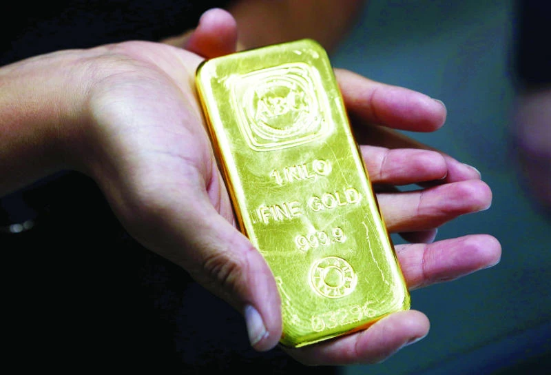 Gold holds steady after 20% surge in 2016