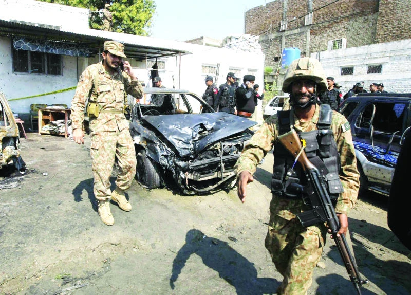 Suicide bomber kills 13 outside Pakistani court