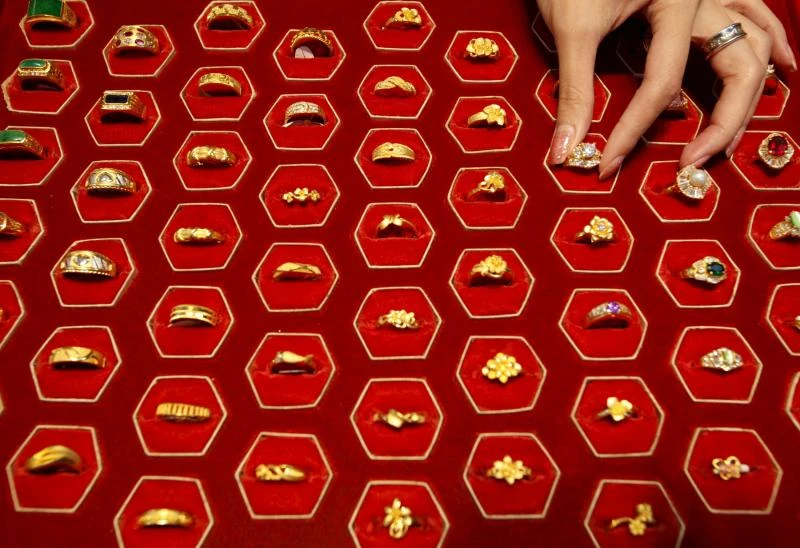 Gold hovers near 13-month high