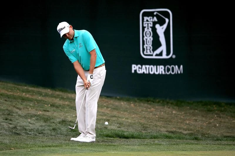 Spieth battles back but Haas grabs lead