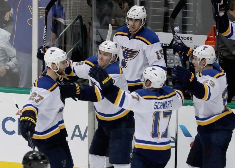Blues win 5-4 in OT to pull into tie with Stars atop West