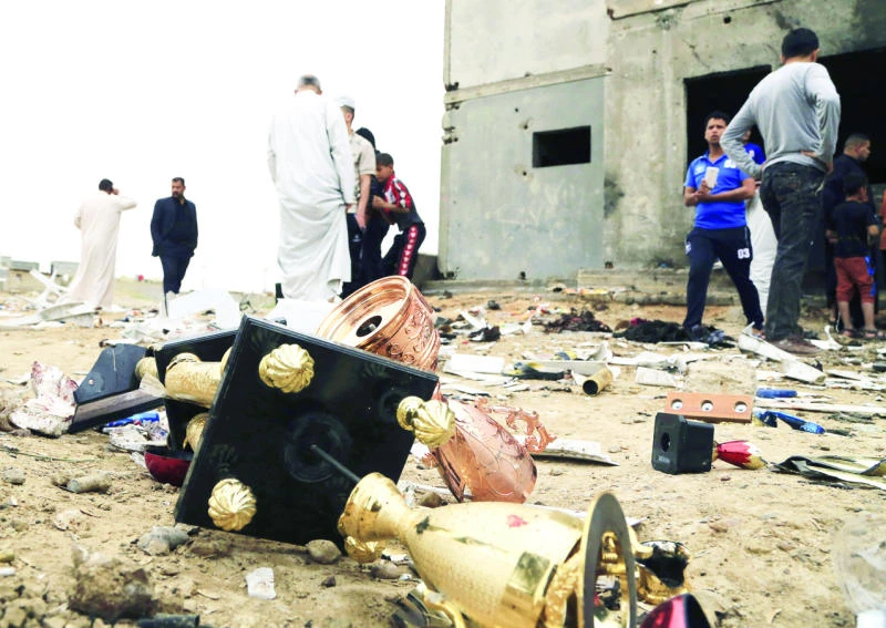 Iraqis bury their dead as stadium attack toll hits 41