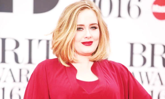 Adele sorry for fan injury at Glasgow show