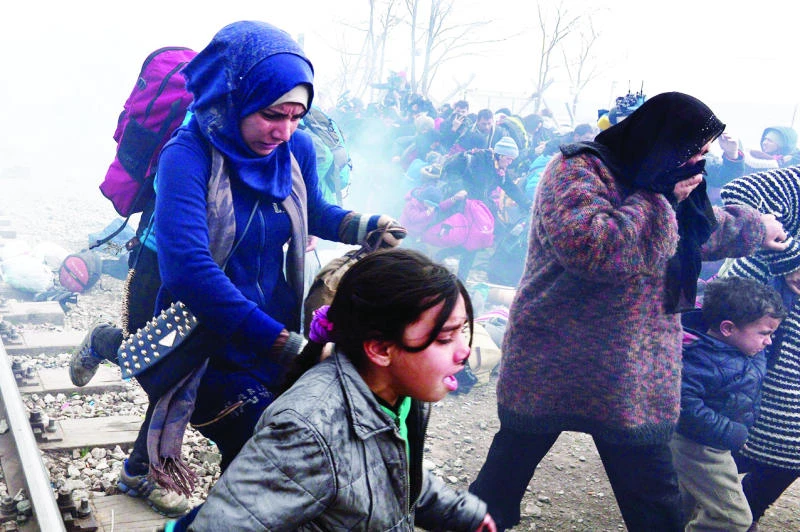 Macedonian police tear-gas migrants near Greek border