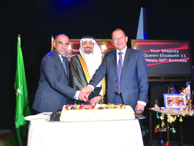 PARTY TIME: Mohammed Shoukat, Adel Abdurrahman Bakhsh and Simon Collis during the celebration in Jeddah.