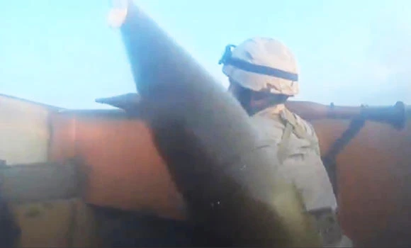 An Islamic State fighter is seen carrying a rocket-propelled grenade launcher in Iraq, in this still image taken from an amateur video supplied by Kurdish Peshmerga and received by Reuters on Friday. (Reuters)