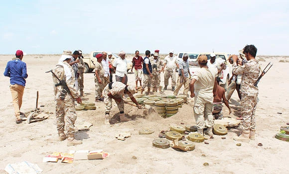 Yemeni security forces inspect unexploded ordnance confiscated from Al-Qaeda militants in the Lahj province, as they prepare to neutralise mines and explosives in the desert of al-Alam, east of the southern port city of Aden, on Friday. (AFP)