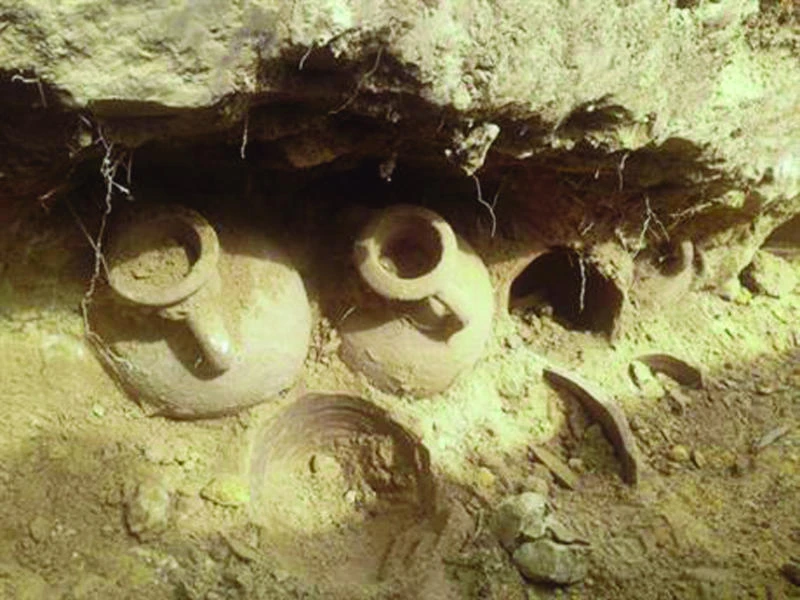 BURIED HISTORY: Some of the 19 amphoras containing thousands of unused bronze and silver-coated coins dating from the end of the 4th century, on Friday. (AP)