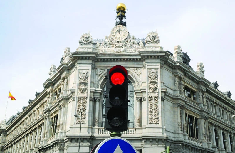 Spanish banks have launched a new phase of cost cutting including employee reductions. (AFP)