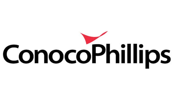 ConocoPhillips swings to loss and slashes budget