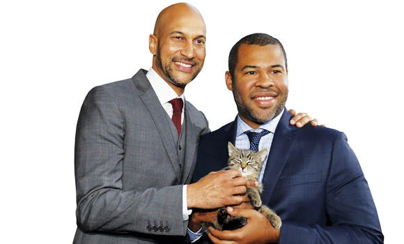 Cast members Keegan-Michael Key, left, and Jordan Peele hold a kitten named Warren at the premiere of “Keanu” at ArcLight in Los Angeles on Wednesday. (Reuters)