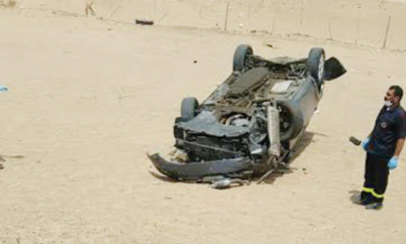TRAGIC ACCIDENT: The ill-fated car in which the family was travelling lies overturned along the Makkah-Madinah Expressway.