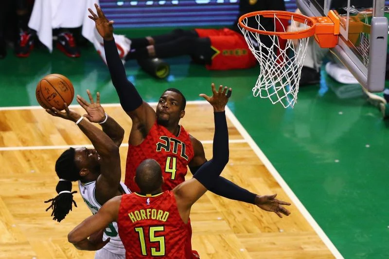 TENSE MOMENT: Paul Millsap (4) of the Atlanta Hawks and Al Horford (15) of the Atlanta Hawks defend a shot by Jae Crowder (99) of the Boston Celtics during the first quarter of Game Six of the Eastern Conference Quarterfinals during the NBA Playoffs at TD Garden in Boston, Massachusetts, Thursday. (AFP)