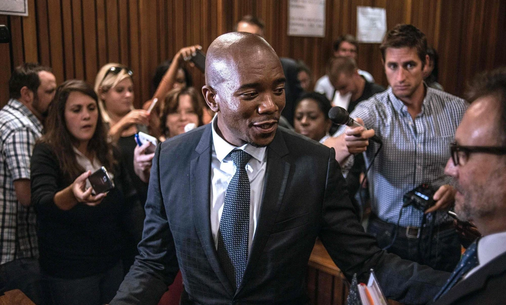 A SHOT IN THE ARM: South Africa’s main opposition party Democratic Alliance leader Mmusi Maimane talks to journalists following the High court’s ruling on the decision that corruption charges against President Jacob Zuma could be reinstated, on Friday, in Pretoria. (AFP)