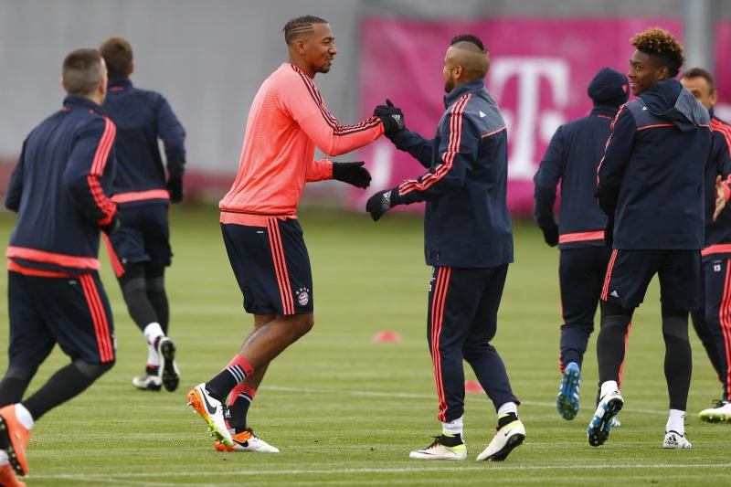 CONFIDENT: Bayern's Jerome Boateng, center, arrives for a training session. A win against Gladbach will confirm a fourth straight German league title, a feat no other team has achieved before. (AP)