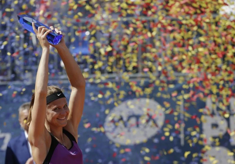 VICTORY AT LAST: Lucie Safarova celebrates with a trophy after winning the final match at the WTA tennis tournament in Prague, Czech Republic, Saturday. (AP)
