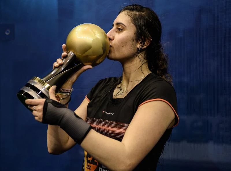SUPREME: Nour El Sherbini kisses her trophy after winning against Laura Massaro after their final match of the PSA Women's World Championships squash tournament in Bukit Jalil, oustide Kuala Lumpur on Saturday. (AFP)