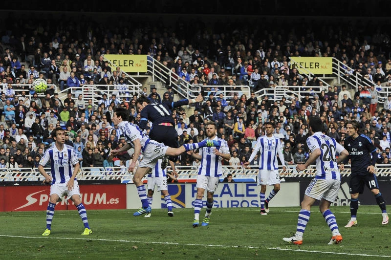 MATCH WINNER: Real Madrid's Gareth Bale, centre, heads the ball before to score against Real Sociedad during the Spanish La Liga soccer match at Anoeta stadium in San Sebastian, northern Spain, Saturday. (AP)