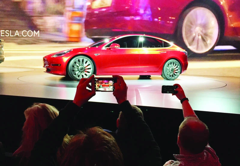 Tesla unveils cheaper model aimed at mass market