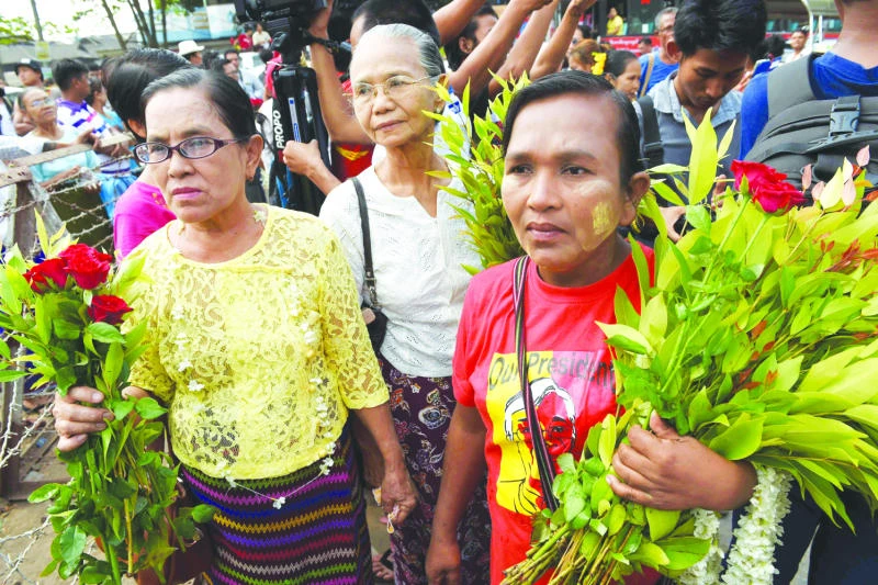 Myanmar court frees student activists after Suu Kyi pledge