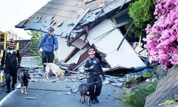 Japan quakes kill at least 32; rescuers rush to free trapped
