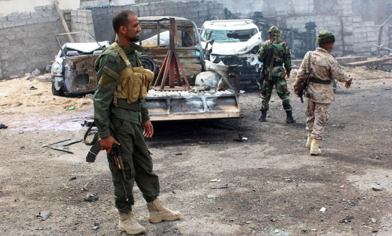 Yemeni loyalist forces gather at the scene of an Al-Qaeda suicide attack in Aden on April 28 following the capture by government forces of the southeastern port city of Mukalla and the nearby airport and oil facilities from the jihadists. (AFP)