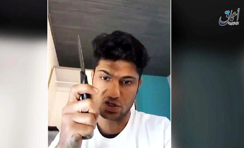 A still image from an undated video Daesh posted July 19, 2016 in which a man whom it identifies as the Afghan refugee who attacked passengers with an ax on a train in Germany vows to carry out a suicide mission and urges other Muslims to do the same. (Social Media via REUTERS TV)