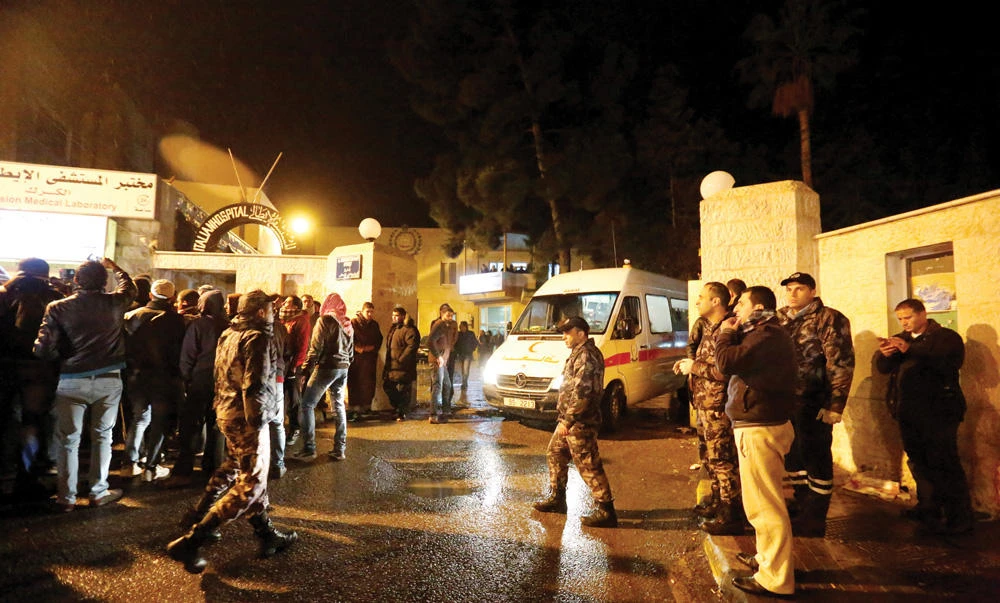 Ambulances are seen in front of the Italian hospital where some of the injured were evacuated to after an attack, in the city of Karak, Jordan, on Sunday. (Reuters)