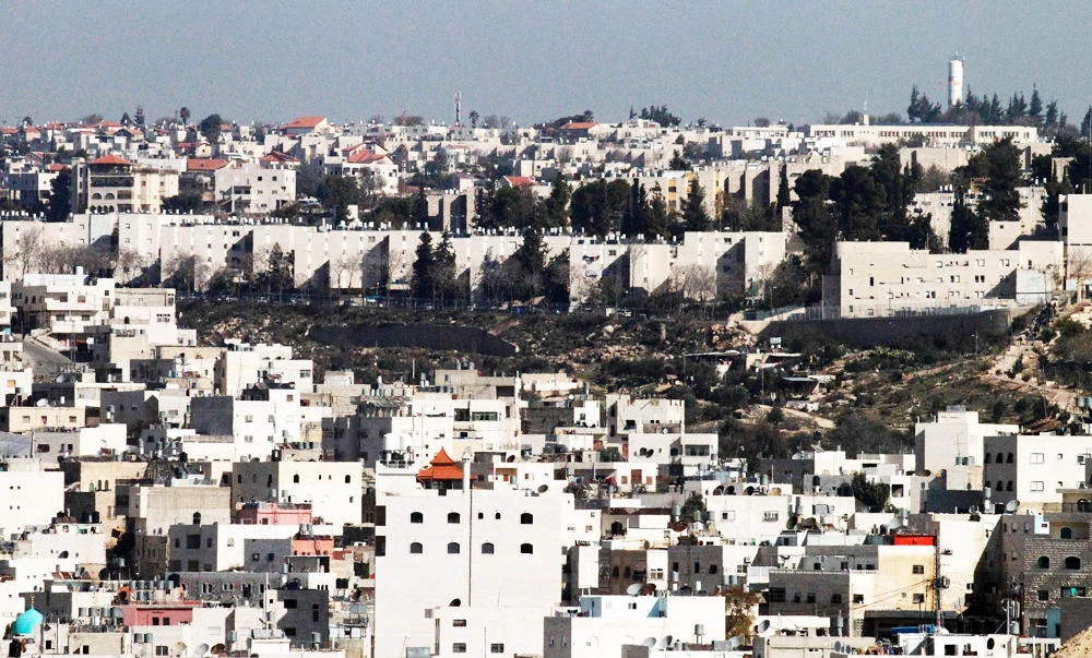 A picture taken from the West Bank city of Hebron on Tuesday shows a view of the Kiryat Arba Jewish settlement on the outskirts of the Palestinian city. (AFP)