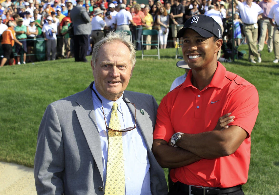 A file photo shows Jack Nicklaus, left, and Tiger Woods talking after Woods won the Memorial golf tournament at the Muirfield Village Golf Club in Dublin, Ohio. (AP)
