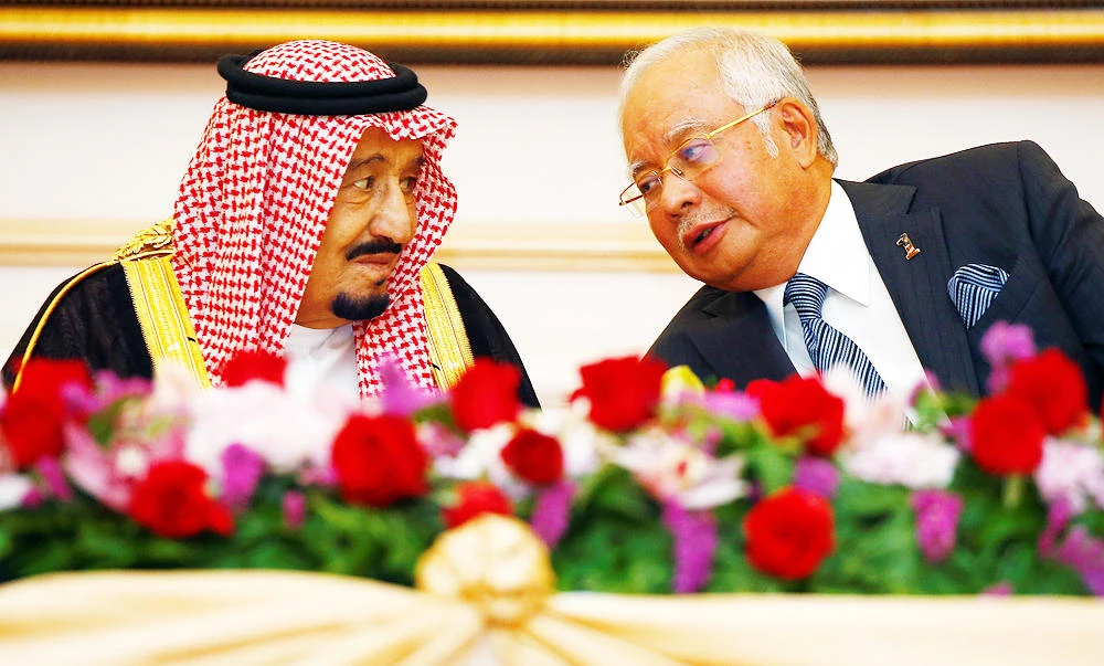 Saudi Arabia's King Salman speaks with Malaysia's Prime Minister Najib Razak during a Memorandum of Understanding signing ceremony in Putrajaya, Malaysia on Monday. (Reuters)