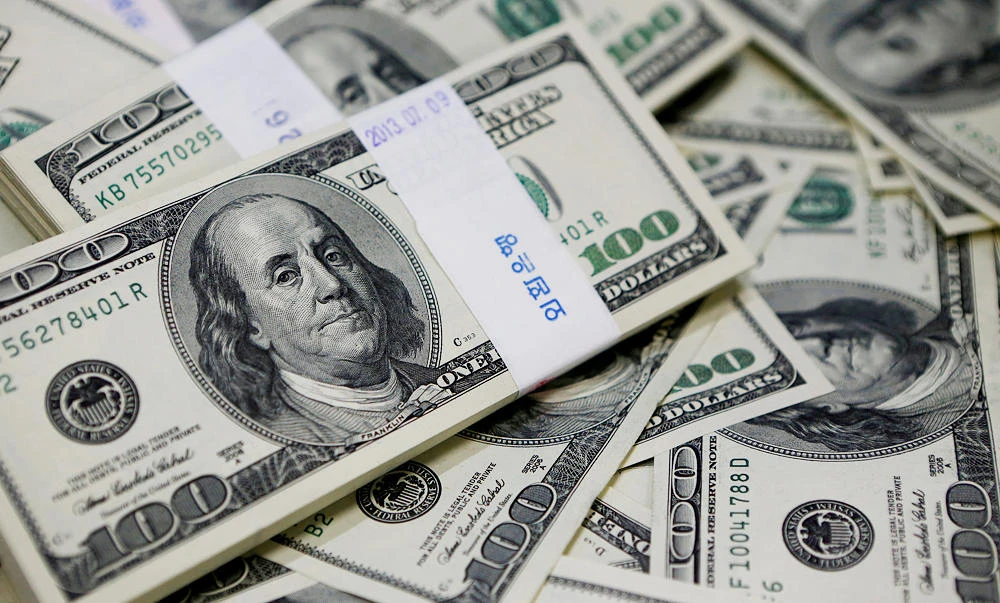 U.S. one hundred dollar bills are seen in this picture illustration, in this August 2, 2013 file photo. (REUTERS)
