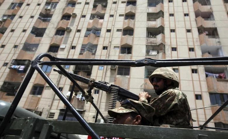 Pakistan Army soldiers guard a street in front of a residential building in Karachi, Pakistan in this April 25, 2015 file photo. (REUTERS)